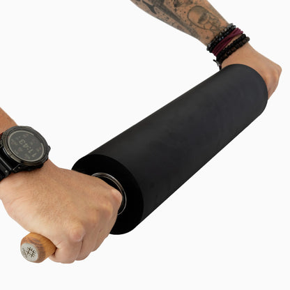 Two hands working with Ritualis Press Lino Pin Roller